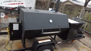 Barrel-style custom pellet smoker, a uniquely crafted smoking apparatus designed for flavor enthusiasts.